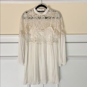 Snow-white sequin baby-doll dress.